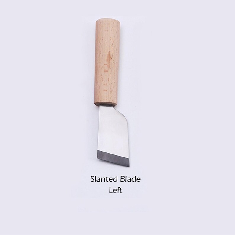 May include: A small, wooden-handled knife with a slanted blade. The blade is angled to the left.