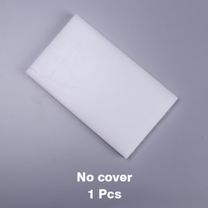 Puede incluir: Una cubierta blanca rectangular en blanco para un producto. La cubierta est&aacute; colocada plana sobre una superficie gris. El texto "No cover 1 Pcs" est&aacute; impreso debajo de la cubierta.