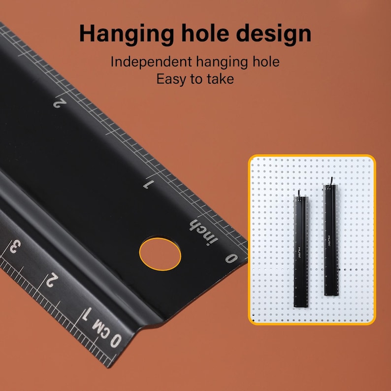 May include: A black ruler with a hanging hole design. The ruler has markings in inches and centimeters. The text "Hanging hole design" and "Independent hanging hole" is visible in the image. The text "Easy to take" is also visible in the image.