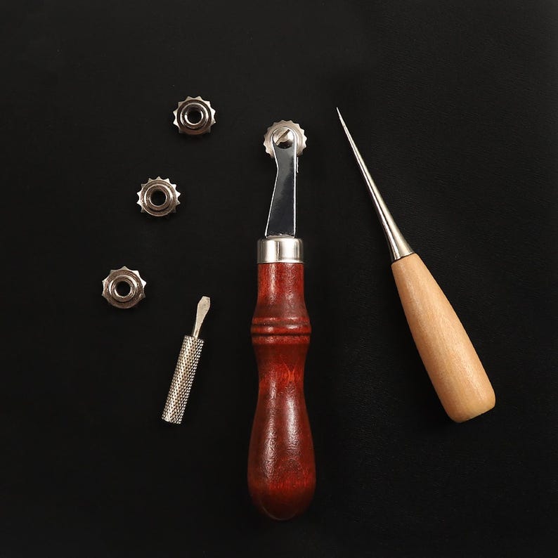 May include: A set of leather crafting tools including a stitching awl, a stitching groover, a stitching pony, and four stitching needles.