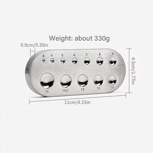May include: A silver metal gauge with ten round holes of different sizes, labeled with numbers from 3 to 15. The gauge is 11 inches long and 1.77 inches wide. It weighs approximately 330 grams.