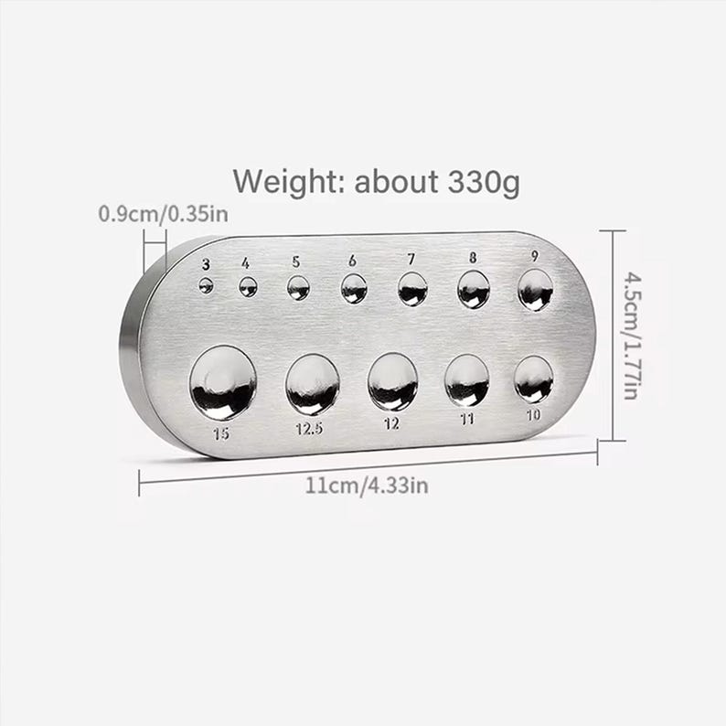 May include: A silver metal gauge with ten round holes of different sizes, labeled with numbers from 3 to 15. The gauge is 11 inches long and 1.77 inches wide. It weighs approximately 330 grams.