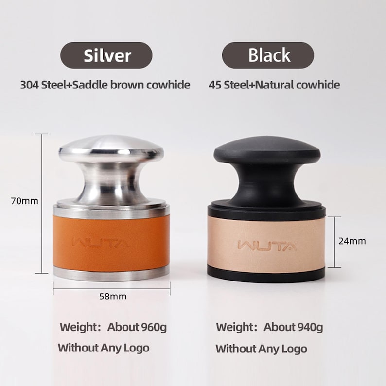 May include: Two coffee tampers, one silver and one black, are displayed. The silver tamper is 70mm tall and 58mm wide, with a saddle brown cowhide band. The black tamper is 24mm tall, with a natural cowhide band. Each weighs approximately 960g and 940g.
