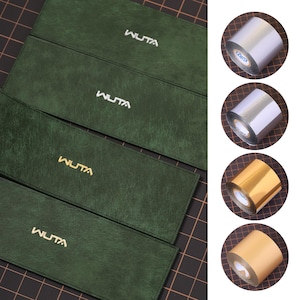 May include: An image showcases four dark green rectangular cases with the word "WUTA" in gold lettering. To the right, there are four rolls of metallic foil in silver and gold colors, with the brand name "KURZ" visible on one.