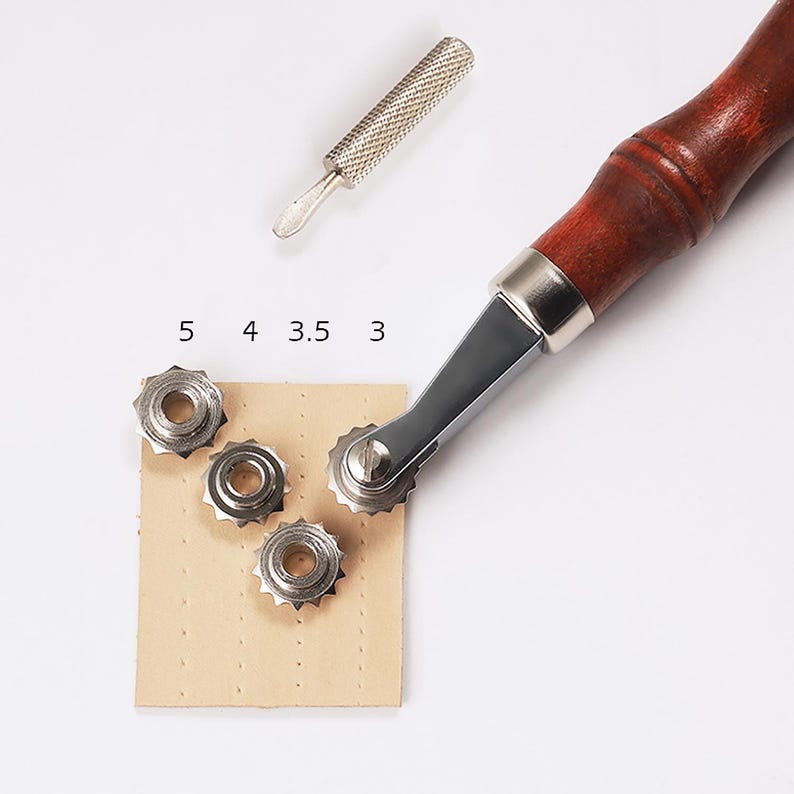 May include: A leather stitching tool with a wooden handle and a metal wheel with adjustable settings labeled 3, 3.5, 4, and 5. The tool is being used to stitch a piece of leather.