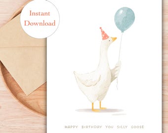 May include: A watercolor birthday card featuring a white goose wearing a party hat and holding a blue balloon. The text "Happy Birthday You Silly Goose" is printed below the illustration. A brown envelope is visible in the background.