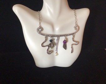 Whimsical aluminum necklace with baubles