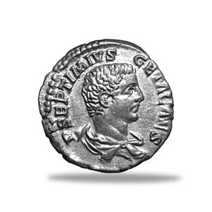 May include: A silver Roman coin featuring a profile of a man with short hair and a laurel wreath. The coin has inscriptions around the edge and is set against a white background. The coin appears to be an antique.