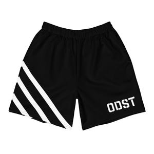 May include: Black athletic shorts with white diagonal stripes and the word "ODST" printed in white on the right leg.