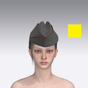 May include: A dark gray garrison cap featuring a distinct red piping trim along the edges. The cap is shaped with a central fold and pointed sides. To the right of the cap, there is a solid, bright yellow square shape against a plain background.