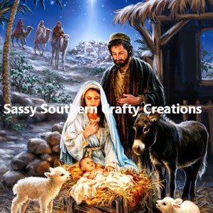 May include: A digital painting depicting the Nativity scene. Mary and Joseph are looking at baby Jesus in a manger, with a donkey and two lambs nearby. The text "Sassy Southern Crafty Creations" is visible.