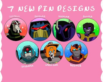 May include: A pink background with the text "7 NEW PIN DESIGNS" above seven circular character portraits. The characters are Lock Down, Soundwave, Shockwave, Swindle, Long Arm, Wreck-Gar, and Rodimus. Each character has a unique color scheme.