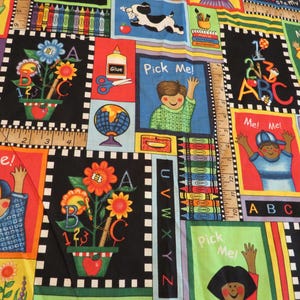 May include: A colorful fabric with a school theme. The fabric features images of children, books, pencils, crayons, and letters. The fabric is perfect for crafting projects, quilting, and sewing.