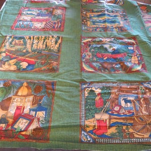 May include: Green fabric with a repeating pattern of colorful illustrations depicting scenes from the outdoors. The illustrations include a canoe, a cabin, a campfire, a duck, a fish, and a bear. The fabric is perfect for quilting, crafts, and home decor.