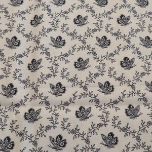 May include: White fabric with a repeating pattern of black butterflies and vines. The butterflies are stylized and have a delicate design.