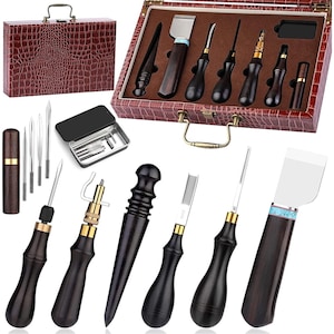 May include: Leather craft tool set with a variety of tools for stitching, cutting, and finishing leather. The set includes a stitching awl, a leather skiver, a leather punch, a leather edge beveler, a leather burnisher, a leather stitching groover, and a leather stitching pony. The tools are made of high-quality materials and are designed to last. The set comes in a brown leather case with a crocodile pattern.