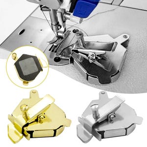 May include: A metal magnetic sewing machine seam guide featuring a spring-loaded adjustment screw and a flat base. The device is shown in gold and silver finishes, with one unit attached to a sewing machine needle plate and another showing the underside.