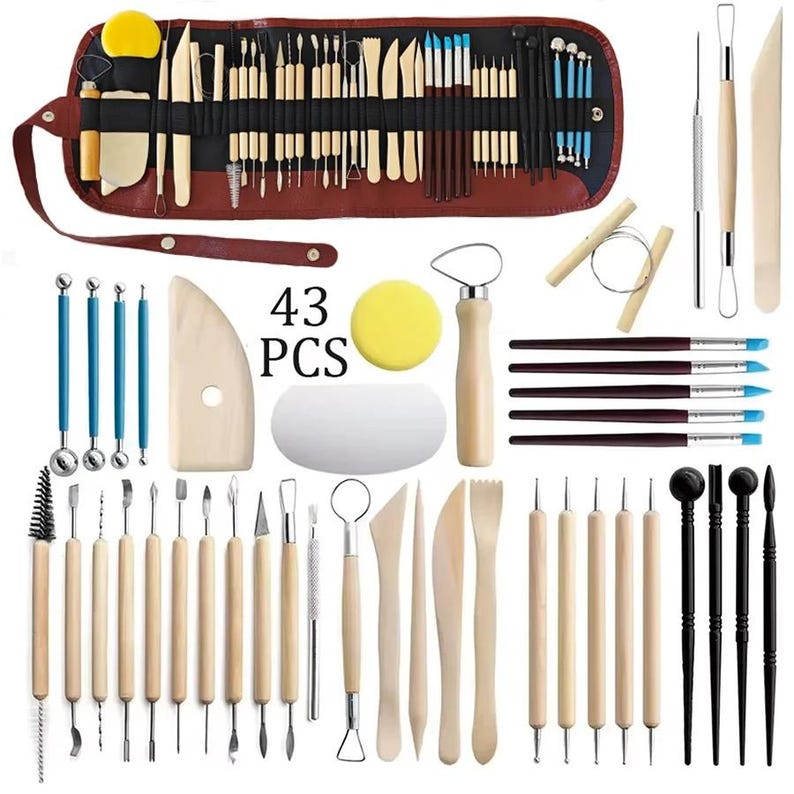 May include: A 43-piece pottery and sculpting tool set. The set includes various tools with wooden and metal handles, brushes, sponges, and a brown leather-like roll-up case for storage. The tools are designed for shaping and detailing clay.