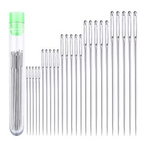 May include: A collection of sewing needles of varying sizes. The needles are silver and arranged in rows. A clear plastic tube with a green cap contains a bundle of needles. The needles are for sewing and crafting.