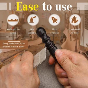 May include: A dark brown leathercraft tool is held in a person's hands, used on a piece of gray leather. The tool has a decorative handle and is being used to smooth the leather. Text in the image reads "Ease to use".