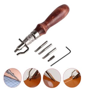 May include: A leathercraft stitching tool with a wooden handle, silver metal components, and a set of interchangeable blades. Includes an Allen wrench. The tool is designed for leatherworking and crafting.