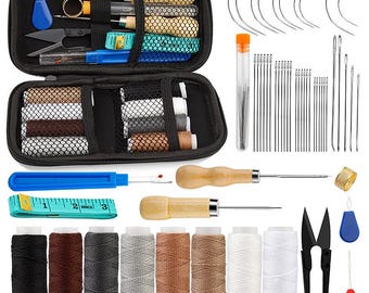 May include: A black zippered sewing kit with various tools and supplies. Includes spools of thread in multiple colors, needles, scissors, a thimble, and a measuring tape. Also features a seam ripper, awls, and a needle threader. A comprehensive set for sewing and crafting.