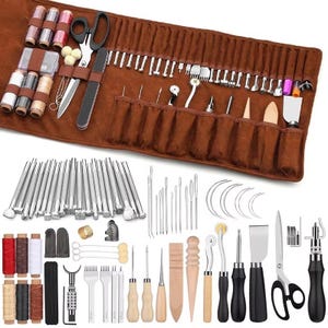 May include: A comprehensive leather crafting tool kit. The set includes various tools such as needles, scissors, thread spools, and cutting tools. The tools are arranged on a brown leather roll-up case. The kit is designed for leatherwork and crafting projects.