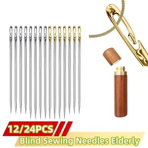 May include: A collection of blind sewing needles, some with gold-colored eyes, alongside a gold needle threader and a wooden needle case. The image includes text that reads "12/24PCS" and "Blind Sewing Needles Elderly".