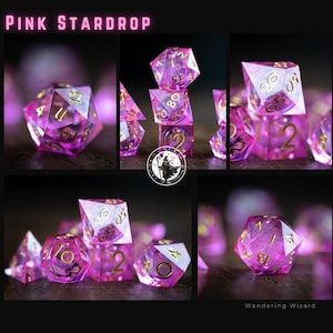 May include: A collection of Pink StarDrop dice. The image features several polyhedral dice, each with a translucent pink hue and gold numerals. The text "Pink StarDrop" is at the top, and "Wandering Wizard" is at the bottom of the image.