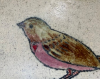 Bird with a heart tile