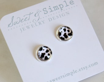 Cow print glass dome post earrings.  Silver setting.  Small black and white cow pattern studs. 8mm.