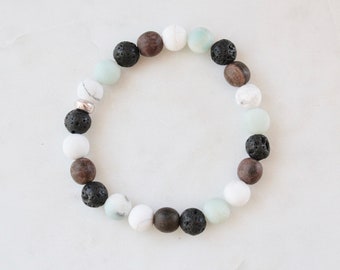 Beaded essential oil diffuser bracelet.  Amazonite, matte white marble, lava and wood beads.  Wooden boho bracelet.  Stacking bracelet.