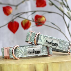 May include: Two green and white patterned dog collars with rose gold hardware and the text "Hannniberry Designs".