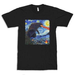 May include: Black t-shirt featuring a graphic of Godzilla in a starry night scene, with a fiery breath. The design is reminiscent of Van Gogh's style, with swirling blues, yellows, and oranges. The shirt is a crew neck style.