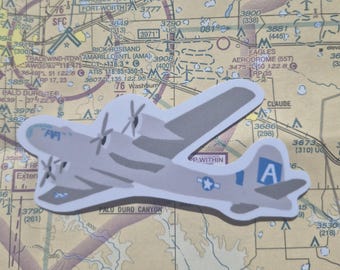May include: A gray and white sticker of a vintage airplane with a blue star on the tail. The sticker has the text "OP WITHIN" on the bottom.