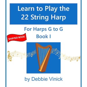 May include: A book cover with a blue background and a drawing of a harp. The text reads "Learn to Play the 22 String Harp" and "For Harps G to G Book I" by Debbie Vinick. A red banner says "SHIPPED BOOK".