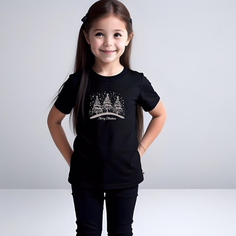 May include: Black t-shirt with a white design of three Christmas trees with snowflakes and the text "Merry Christmas".