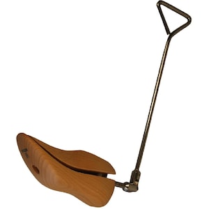 May include: A wooden shoe stretcher with a metal handle. The shoe stretcher is made of light-colored wood and has a curved shape to fit inside a shoe. The metal handle is attached to the stretcher and has a triangular grip.