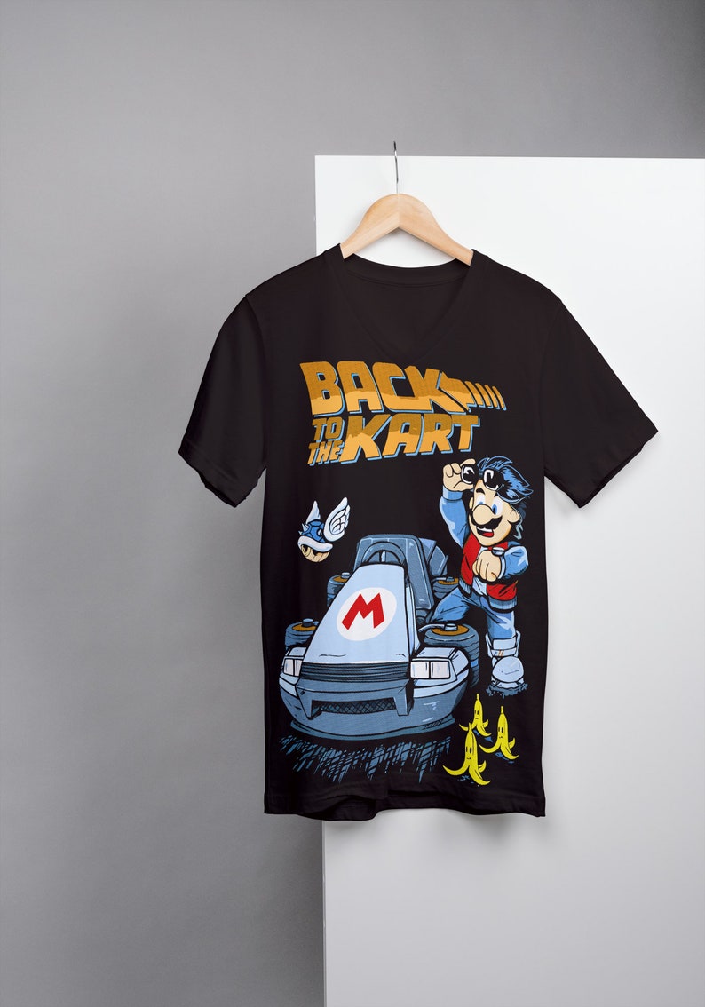 May include: Black t-shirt with a graphic of Mario in a go-kart, with the text "Back to the Kart" in gold lettering.