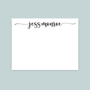 May include: A rectangular white stationery card featuring the name jess monroe printed in a black cursive script font centered at the top. The card has a clean, smooth surface and provides a large blank area below the text for writing notes.