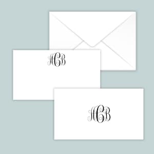 May include: Two white rectangular note cards and one white envelope. Each note card features a black decorative monogram with the letters ACB in a swirling script font centered at the top. The envelope is plain white with a triangular flap.