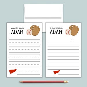 May include: Two white stationery cards with the text a note from ADAM, a brown baseball glove, a baseball, and a red pennant. One card features dashed writing lines, the other solid lines. A white envelope and a red pencil are also included.