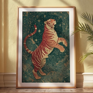 May include: A framed art print showcasing a stylized tiger in a vintage style. The tiger, in red and cream hues, stands on its hind legs against a dark teal backdrop with stars. The print is enclosed in a gold-toned frame, providing a touch of sophistication.