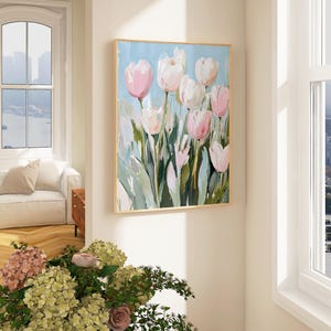 May include: A painting of pink and white tulips with green leaves against a light blue background.