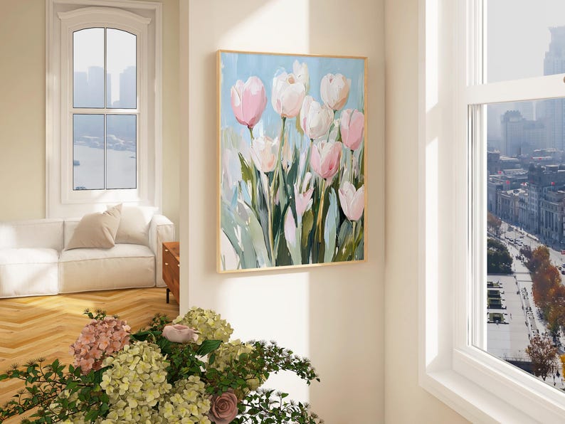 May include: A painting of pink and white tulips with green leaves against a light blue background.