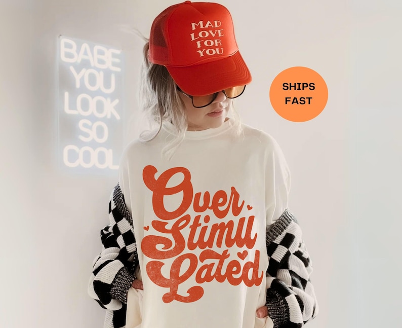 Overstimulated

Feeling Overstimulated? Same. This Comfort Colors® Overstimulated Shirt for Mom brings retro vibes with funky text and cowboy frog chaos. The ultimate Gen Z shirt and unhinged tshirt for anyone deep in their weirdcore clothing era. A vintage shirt feel with soft garment dyed comfort. Perfect gift for her, motivational shirt (kinda), or oversized shirt to scream in style. Tees for women just got funnier.