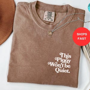 This Piggy Won't Be Quiet - Anti-Trump Leftist Shirt.

Make a bold statement with this Pro Democracy T-Shirt and Anti-Trump Tshirt, designed for activists who demand justice. This Anti Trump Political Leftist Tee and Anti Dictator & Anti MAGA Democrat Gift is perfect for rallies, protests, or everyday resistance. A must-have Anti-Trump Protest Tee, Anti-MAGA Tee, and Activist Shirt. Show your stance with this Anti Trump T Shirt, Trump Sucks Shirt, and Democrat Shirt.