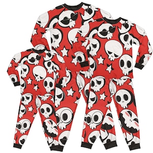 May include: Red pajamas with a white skull and star pattern. The pajamas are available in different sizes.