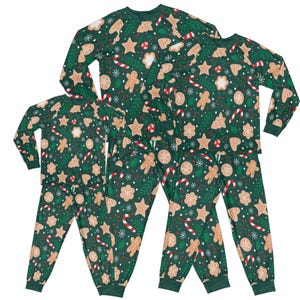 May include: A set of green pajamas with a gingerbread cookie pattern. The pajamas feature gingerbread men, candy canes, stars, and snowflakes.