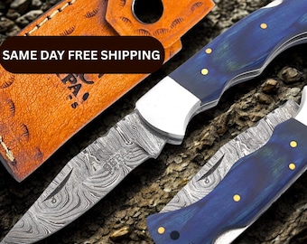 Navaja plegable de Damasco hecha a mano: mango azul Pakka, funda de cuero.